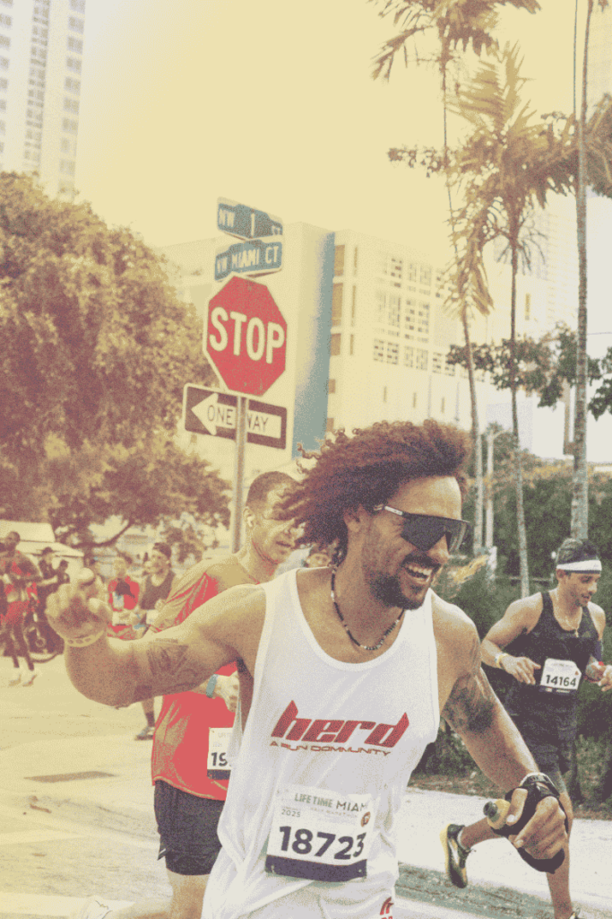 A photograph of a man running the Miami marathon